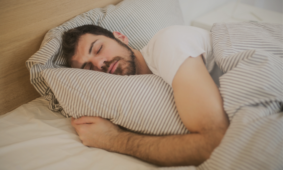 Person sleeping in bed